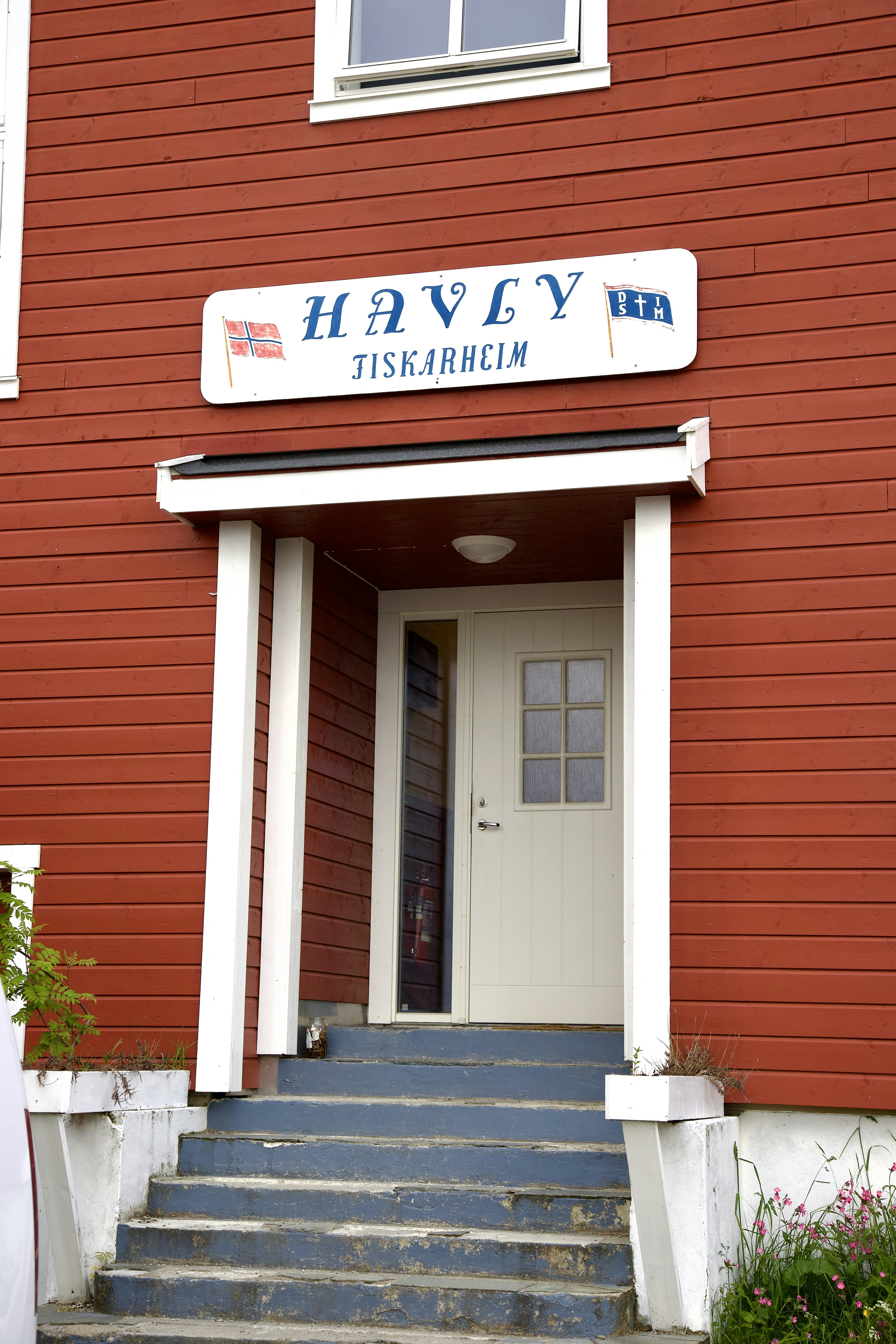 a red building with stairs leading up to it